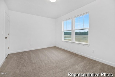 This semi-custom home in Lake Royale offers 3BR/2.5BA and over 2 on River Golf and County Club at Lake Royale in North Carolina - for sale on GolfHomes.com, golf home, golf lot