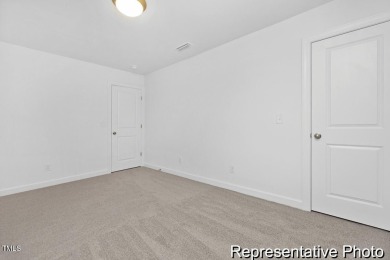 This semi-custom home in Lake Royale offers 3BR/2.5BA and over 2 on River Golf and County Club at Lake Royale in North Carolina - for sale on GolfHomes.com, golf home, golf lot