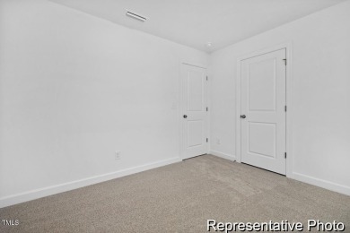 This semi-custom home in Lake Royale offers 3BR/2.5BA and over 2 on River Golf and County Club at Lake Royale in North Carolina - for sale on GolfHomes.com, golf home, golf lot
