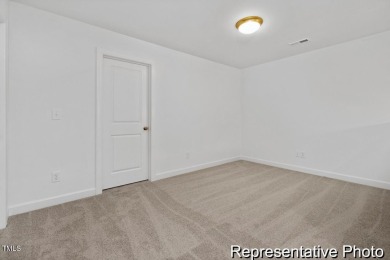 This semi-custom home in Lake Royale offers 3BR/2.5BA and over 2 on River Golf and County Club at Lake Royale in North Carolina - for sale on GolfHomes.com, golf home, golf lot