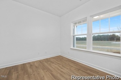 This semi-custom home in Lake Royale offers 3BR/2.5BA and over 2 on River Golf and County Club at Lake Royale in North Carolina - for sale on GolfHomes.com, golf home, golf lot
