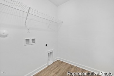 This semi-custom home in Lake Royale offers 3BR/2.5BA and over 2 on River Golf and County Club at Lake Royale in North Carolina - for sale on GolfHomes.com, golf home, golf lot