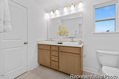 This semi-custom home in Lake Royale offers 3BR/2.5BA and over 2 on River Golf and County Club at Lake Royale in North Carolina - for sale on GolfHomes.com, golf home, golf lot