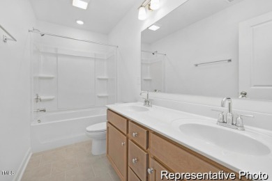 This semi-custom home in Lake Royale offers 3BR/2.5BA and over 2 on River Golf and County Club at Lake Royale in North Carolina - for sale on GolfHomes.com, golf home, golf lot