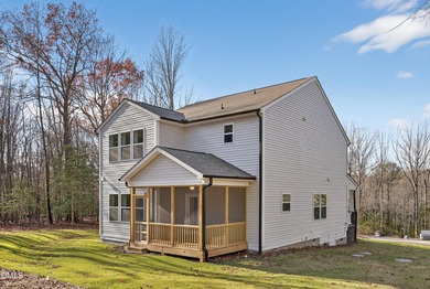 This semi-custom home in Lake Royale offers 3BR/2.5BA and over 2 on River Golf and County Club at Lake Royale in North Carolina - for sale on GolfHomes.com, golf home, golf lot