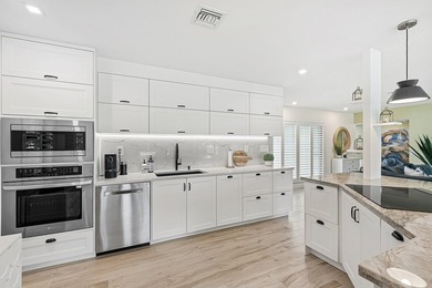 Tranquil golf course views from this 2-bedroom, 2-bath on Quail Ridge Golf Course and Country Club in Florida - for sale on GolfHomes.com, golf home, golf lot