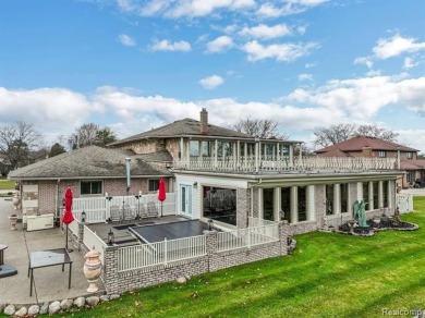 Welcome to 17867 Yorkshire Drive, an architectural masterpiece on Riverview Highlands Golf Club  in Michigan - for sale on GolfHomes.com, golf home, golf lot