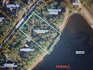 Exceptional .95-acre lakefront lot within the exclusive Pinewild on Pinewild Country Club of Pinehurst in North Carolina - for sale on GolfHomes.com, golf home, golf lot