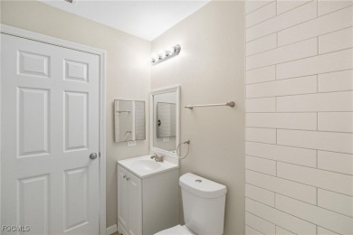Nestled on a private corner lot, this 3-bedroom, 2-bath home on River Hall Country Club in Florida - for sale on GolfHomes.com, golf home, golf lot