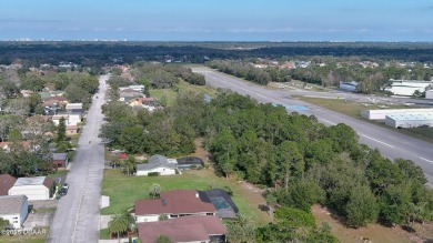 Taxiway Block Hangar home, with a fantastic view of the Spruce on Spruce Creek Golf Club in Florida - for sale on GolfHomes.com, golf home, golf lot