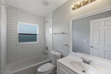 Nestled on a private corner lot, this 3-bedroom, 2-bath home on River Hall Country Club in Florida - for sale on GolfHomes.com, golf home, golf lot