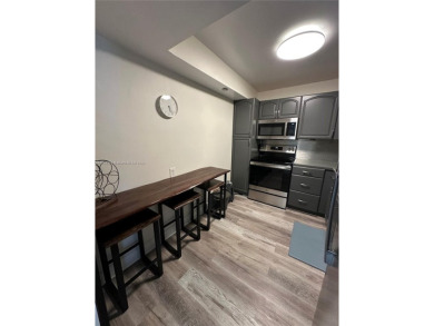 Discover this charming condo with 2 bedrooms and 2 bathrooms on Pembroke Lakes Golf Club in Florida - for sale on GolfHomes.com, golf home, golf lot