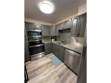 Discover this charming condo with 2 bedrooms and 2 bathrooms on Pembroke Lakes Golf Club in Florida - for sale on GolfHomes.com, golf home, golf lot