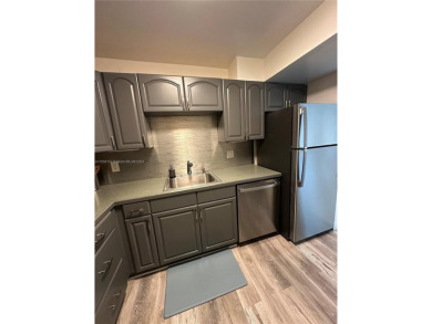 Discover this charming condo with 2 bedrooms and 2 bathrooms on Pembroke Lakes Golf Club in Florida - for sale on GolfHomes.com, golf home, golf lot