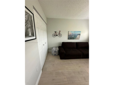 Discover this charming condo with 2 bedrooms and 2 bathrooms on Pembroke Lakes Golf Club in Florida - for sale on GolfHomes.com, golf home, golf lot