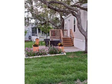 This charming 2022 Factory Expo Direct Park Model sits on one of on Glen Lakes Country Club in Florida - for sale on GolfHomes.com, golf home, golf lot