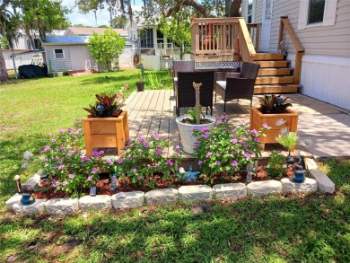 This charming 2022 Factory Expo Direct Park Model sits on one of on Glen Lakes Country Club in Florida - for sale on GolfHomes.com, golf home, golf lot