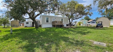 This charming 2022 Factory Expo Direct Park Model sits on one of on Glen Lakes Country Club in Florida - for sale on GolfHomes.com, golf home, golf lot