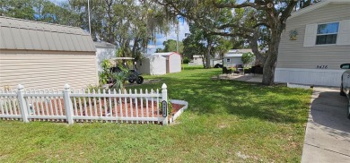 This charming 2022 Factory Expo Direct Park Model sits on one of on Glen Lakes Country Club in Florida - for sale on GolfHomes.com, golf home, golf lot