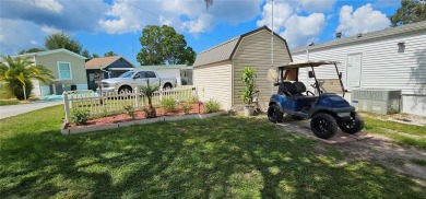 This charming 2022 Factory Expo Direct Park Model sits on one of on Glen Lakes Country Club in Florida - for sale on GolfHomes.com, golf home, golf lot
