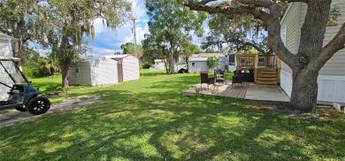 This charming 2022 Factory Expo Direct Park Model sits on one of on Glen Lakes Country Club in Florida - for sale on GolfHomes.com, golf home, golf lot