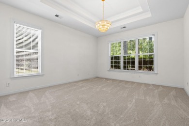 Welcome to this magnificent property offering an array of on Sandpiper Bay Golf and Country Club in North Carolina - for sale on GolfHomes.com, golf home, golf lot