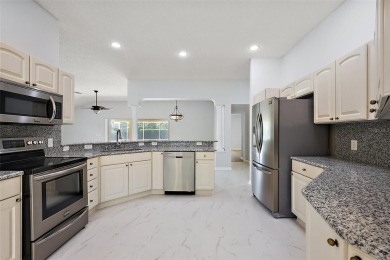 STUNNINGLY UPDATED, GOLF FRONT, 3/2 BLOCK and STUCCO Magnolia on The Links of Spruce Creek in Florida - for sale on GolfHomes.com, golf home, golf lot