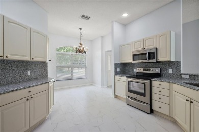 STUNNINGLY UPDATED, GOLF FRONT, 3/2 BLOCK and STUCCO Magnolia on The Links of Spruce Creek in Florida - for sale on GolfHomes.com, golf home, golf lot