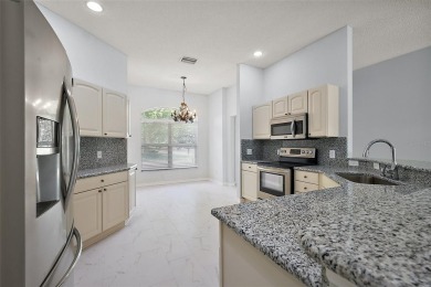 STUNNINGLY UPDATED, GOLF FRONT, 3/2 BLOCK and STUCCO Magnolia on The Links of Spruce Creek in Florida - for sale on GolfHomes.com, golf home, golf lot