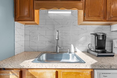 Captivating water views from almost every room in this 2-bedroom on Harbour Point Golf Club in North Carolina - for sale on GolfHomes.com, golf home, golf lot