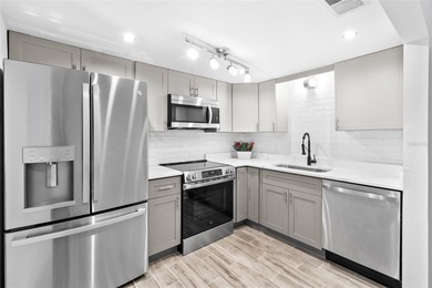 FANTASTIC, COMPLETELY REMODELED GROUND-FLOOR CONDO -- STEPS TO on Treasure Bay Golf and Tennis in Florida - for sale on GolfHomes.com, golf home, golf lot