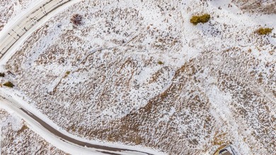 Set the stage for your future in a setting where wide-open space on Headwaters Golf Course At Granby Ranch in Colorado - for sale on GolfHomes.com, golf home, golf lot