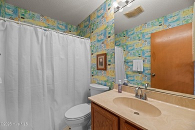 Captivating water views from almost every room in this 2-bedroom on Harbour Point Golf Club in North Carolina - for sale on GolfHomes.com, golf home, golf lot