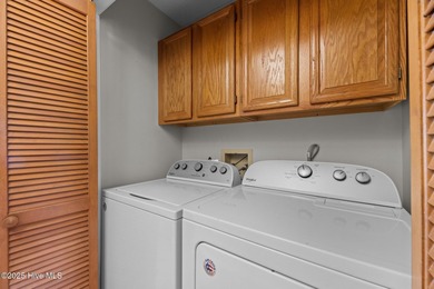 Captivating water views from almost every room in this 2-bedroom on Harbour Point Golf Club in North Carolina - for sale on GolfHomes.com, golf home, golf lot