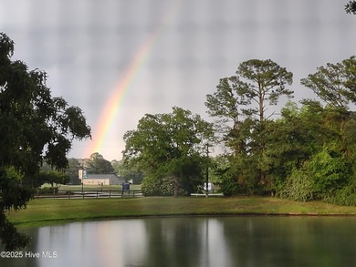 Captivating water views from almost every room in this 2-bedroom on Harbour Point Golf Club in North Carolina - for sale on GolfHomes.com, golf home, golf lot