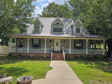 Waterfront living in Lake Hilldale! Built with views in mind on The Kings Arrow Ranch in Mississippi - for sale on GolfHomes.com, golf home, golf lot