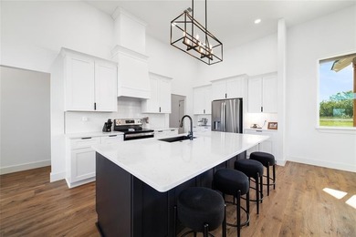 Discover luxury living at 7702 Feather Bay Dr, where new on Hideout Golf Club and Resort  in Texas - for sale on GolfHomes.com, golf home, golf lot