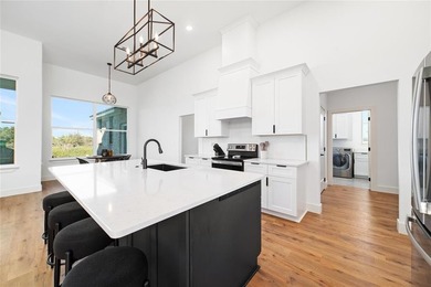 Discover luxury living at 7702 Feather Bay Dr, where new on Hideout Golf Club and Resort  in Texas - for sale on GolfHomes.com, golf home, golf lot