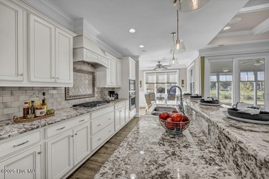 Exceptional curb appeal defines this beautifully designed on Cape Fear National At Brunswick Forest in North Carolina - for sale on GolfHomes.com, golf home, golf lot