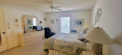 Beautiful end unit condo, located on tranquil pond with serene on Tarpon Woods Golf Club in Florida - for sale on GolfHomes.com, golf home, golf lot