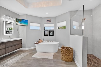 Lakefront Custom Pool Home (built 2023), offering the perfect on Del Tura Golf and Country Club in Florida - for sale on GolfHomes.com, golf home, golf lot