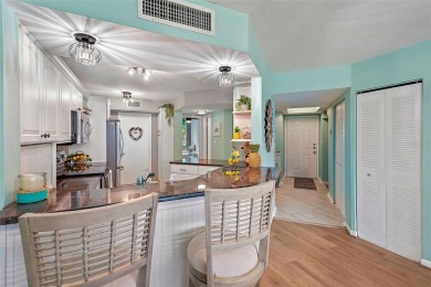 This beautifully updated 2-bedroom plus den residence in the on Isla Del Sol Yacht and Country Club in Florida - for sale on GolfHomes.com, golf home, golf lot