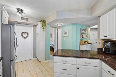 This beautifully updated 2-bedroom plus den residence in the on Isla Del Sol Yacht and Country Club in Florida - for sale on GolfHomes.com, golf home, golf lot