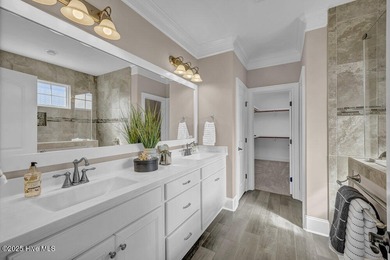 Exceptional curb appeal defines this beautifully designed on Cape Fear National At Brunswick Forest in North Carolina - for sale on GolfHomes.com, golf home, golf lot