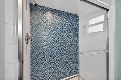 Welcome to waterfront living at its finest in Point Brittany; on Isla Del Sol Yacht and Country Club in Florida - for sale on GolfHomes.com, golf home, golf lot