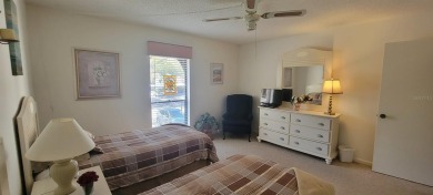 Beautiful end unit condo, located on tranquil pond with serene on Tarpon Woods Golf Club in Florida - for sale on GolfHomes.com, golf home, golf lot