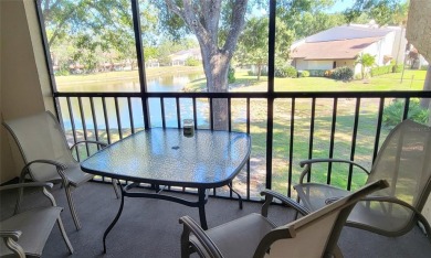 Beautiful end unit condo, located on tranquil pond with serene on Tarpon Woods Golf Club in Florida - for sale on GolfHomes.com, golf home, golf lot