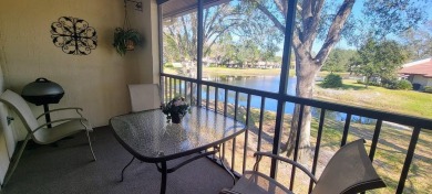 Beautiful end unit condo, located on tranquil pond with serene on Tarpon Woods Golf Club in Florida - for sale on GolfHomes.com, golf home, golf lot