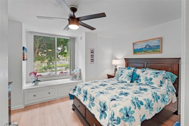 This beautifully updated 2-bedroom plus den residence in the on Isla Del Sol Yacht and Country Club in Florida - for sale on GolfHomes.com, golf home, golf lot