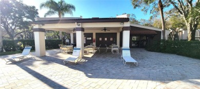 Beautiful end unit condo, located on tranquil pond with serene on Tarpon Woods Golf Club in Florida - for sale on GolfHomes.com, golf home, golf lot